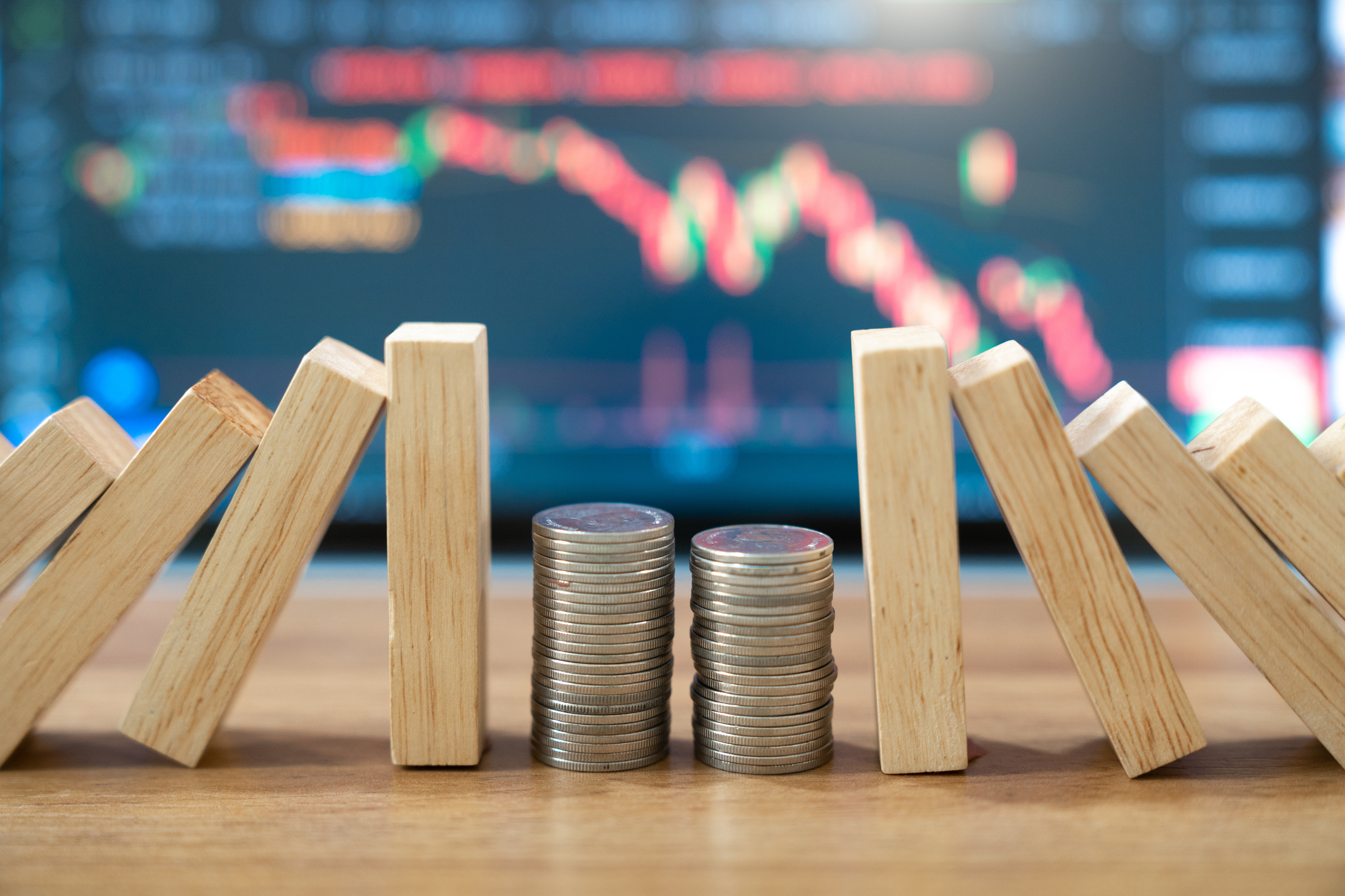 Domino effect concept for stock market investments, risk and safety