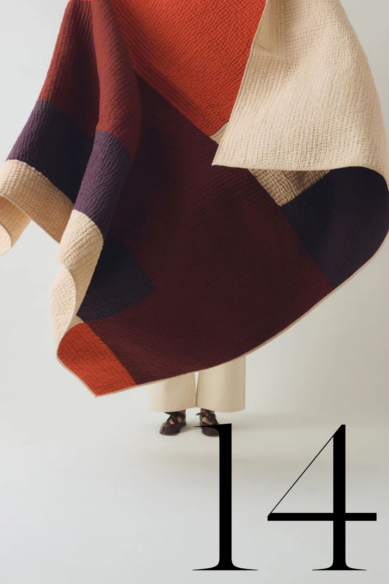 patchwork quilt in orange, purple and beige