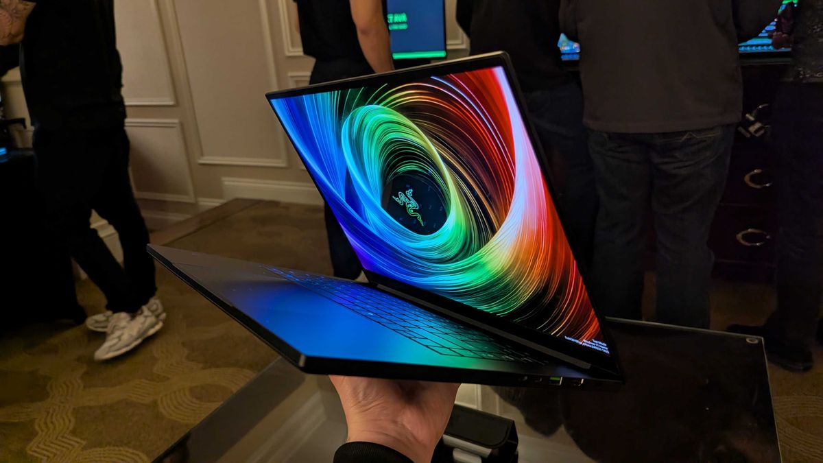 The Razer Blade 16 (2025) held in the hand.