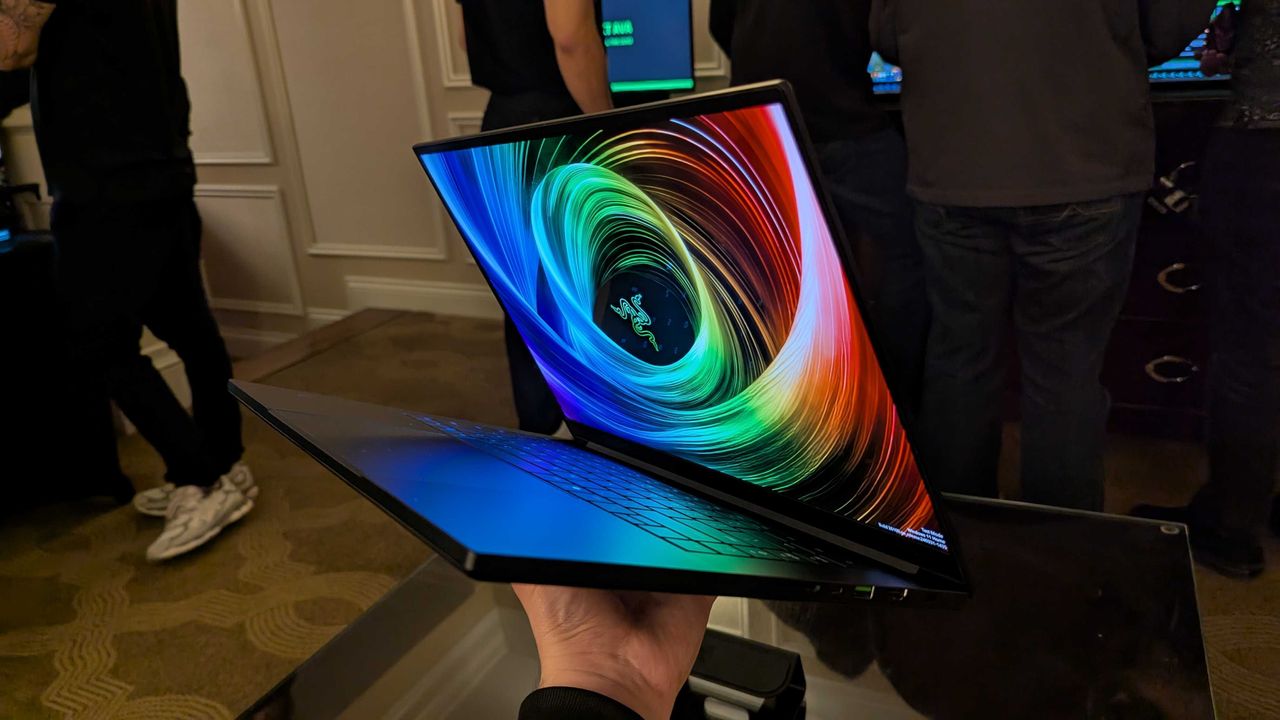 The Razer Blade 16 (2025) held in the hand.