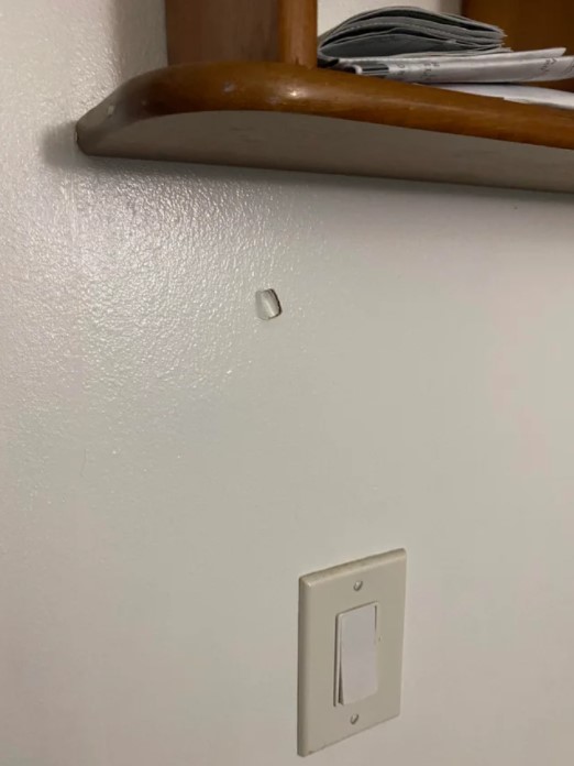 Damage of stray bullet in gamer's bedroom.