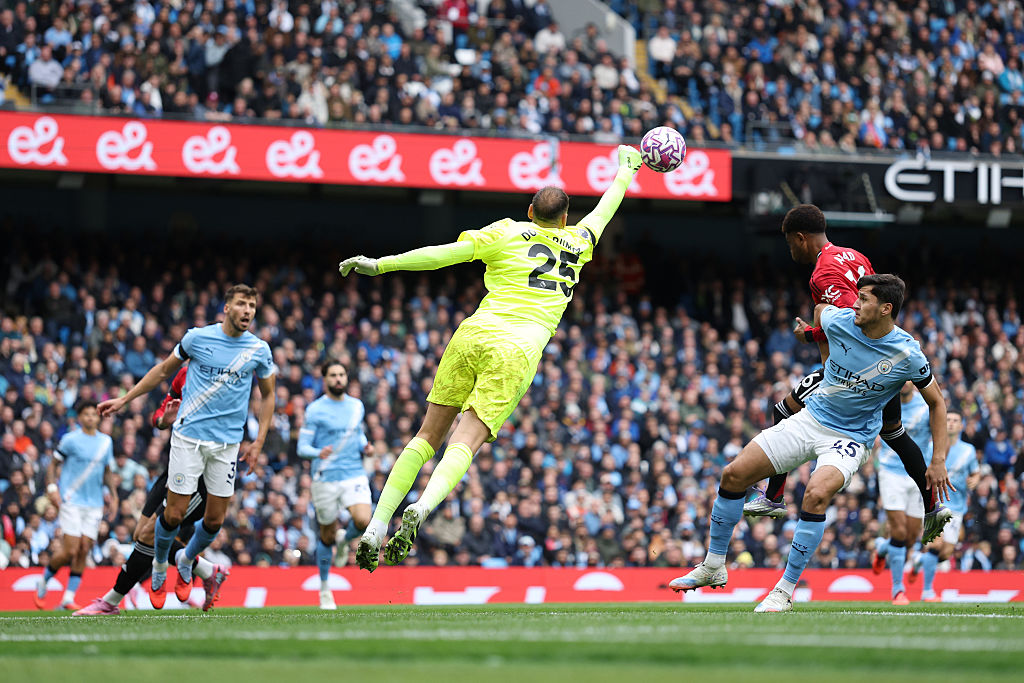 Gianluigi Donnarumma of Manchester City makes a save during the Premier League match between Manchester City and Manchester United at Etihad Stadium on September 14, 2025 in Manchester, England.