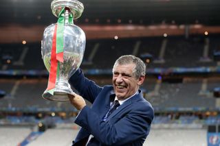 Portugal manager Fernando Santos celebrates with the European Championship trophy, 2016