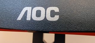 An AOC Gaming C27G2AE curved gaming monitor sitting on a desk