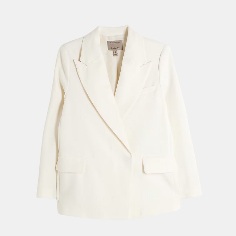 A cutout of a cream blazer by River Island