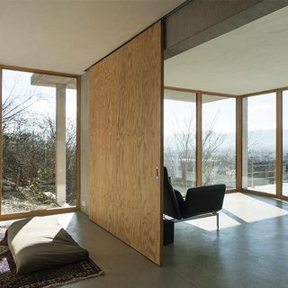 Room with large wooden glass panels in Switzerland