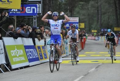 Fedrigo salutes as he crosses the finish line