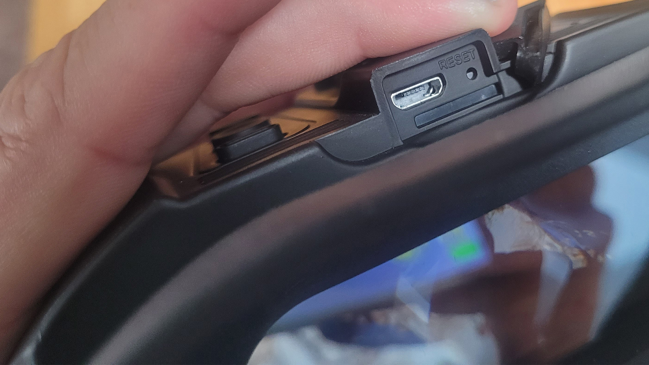 A close up of the hidden Micro-USB port on the Nightfox Swift