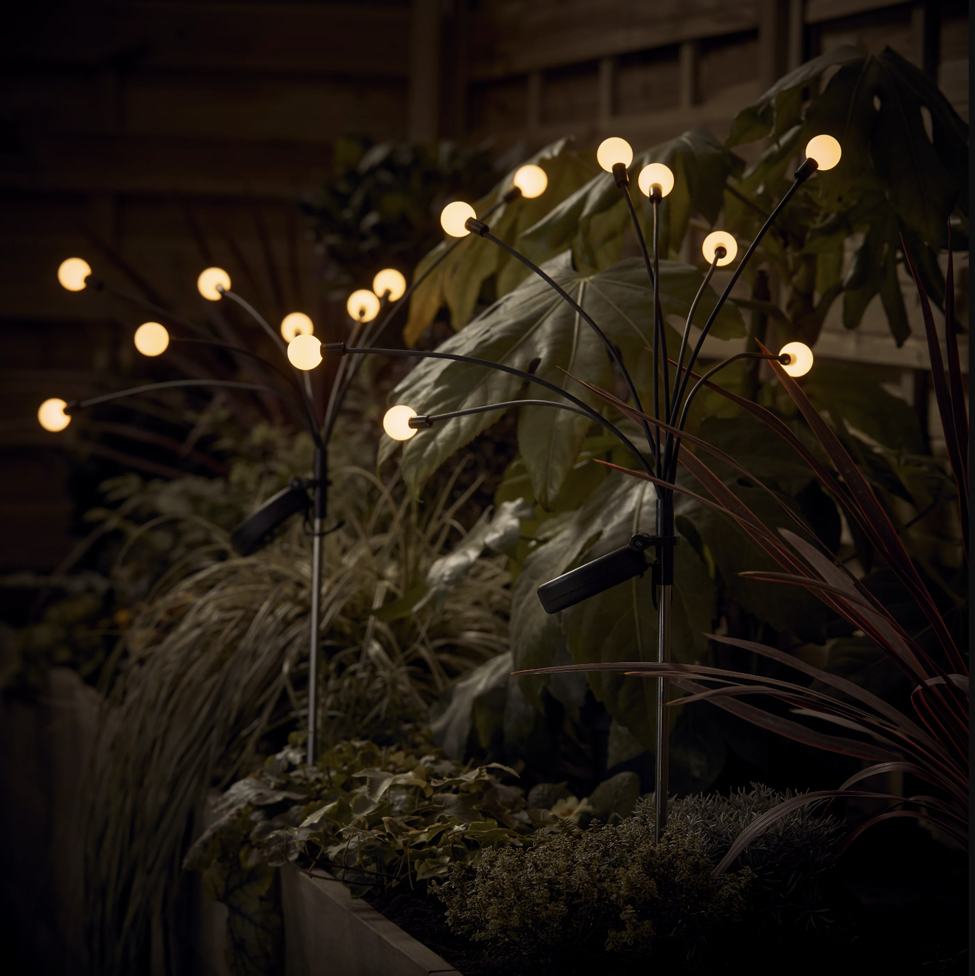 stake lights with glowing orbs