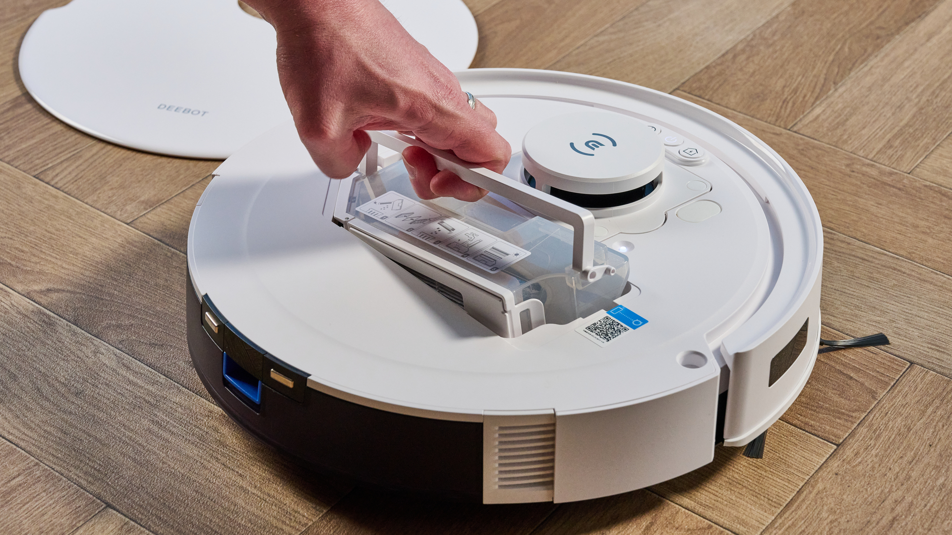 Ecovacs Deebot N20 in white photographed vacuuming floor