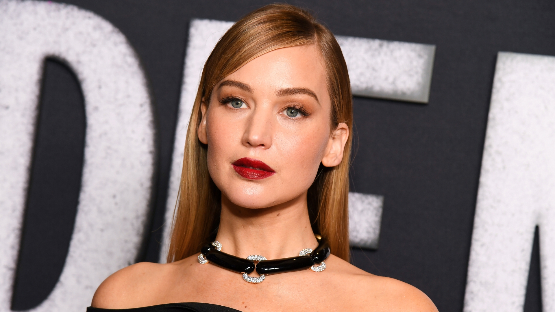 Jennifer Lawrence is pictured wearing a black dress and dark red lipstick at the &quot;Die My Love&quot; New York Premiere held at AMC Lincoln Square on November 01, 2025, in New York, New York.