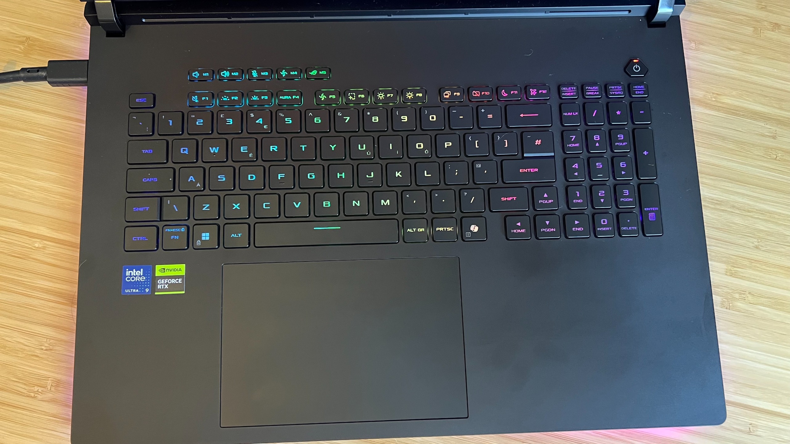 Top down view of Asus ROG Strix Scar 18 gaming laptop keyboard and trackpad