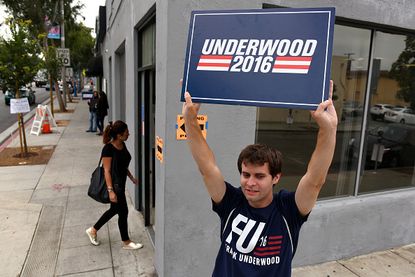 A Netflix employee promotes a character from House of Cards outside a polling station.