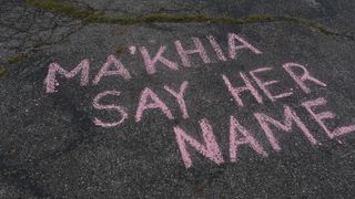 Supporters handwritten message in chalk at vigil for Ma'Khia Bryant