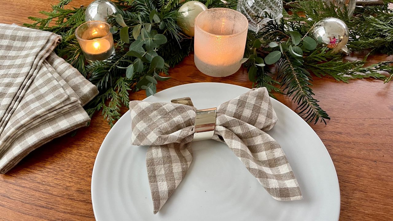 A checked napkin folded into a bow