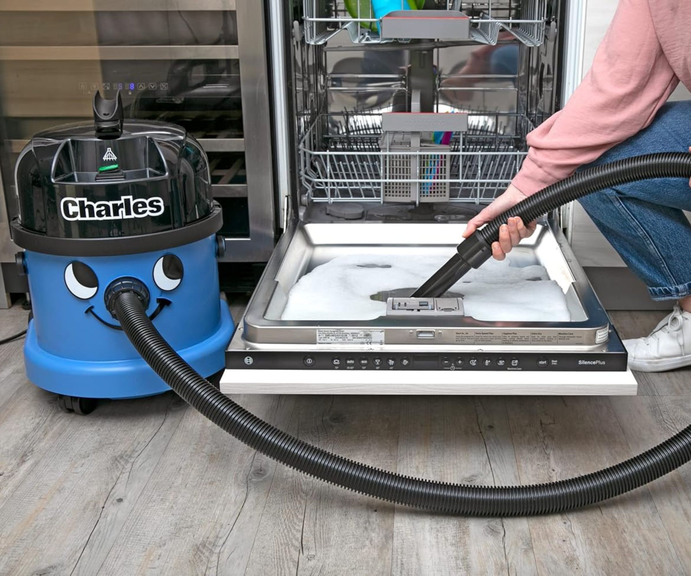 Henry Charles removing water from dishwasher