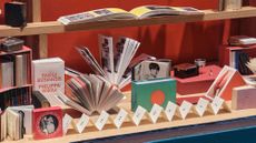 books arranged across exhibition space