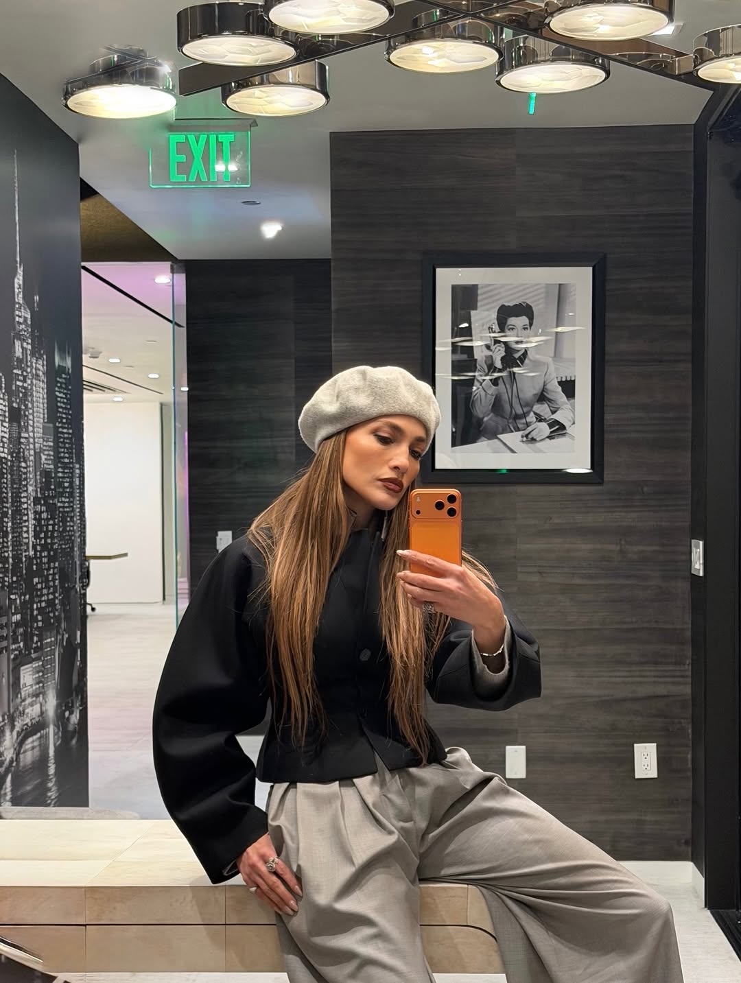 jennifer lopez returned to her L.A. office in a gray beret and matching pleated pants