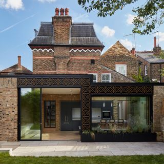 Period home with kitchen extension and ornate cladding