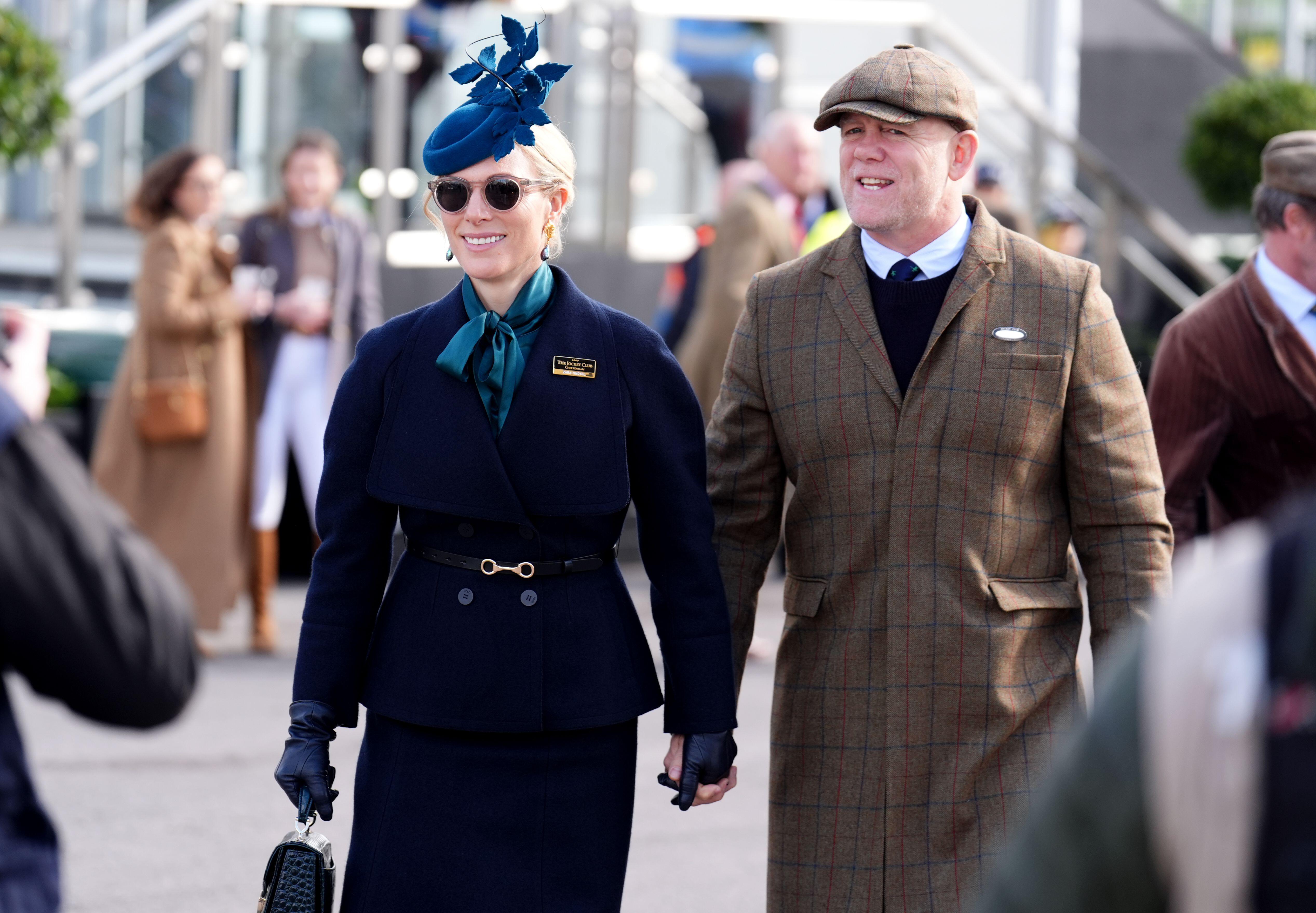 Zara Tindall holding hands with Mike Tindall at the Cheltenham races