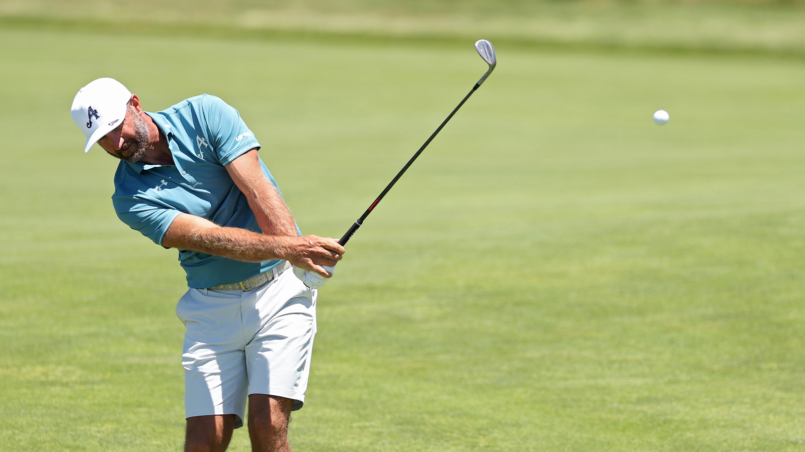 Dustin Johnson hits a wedge shot