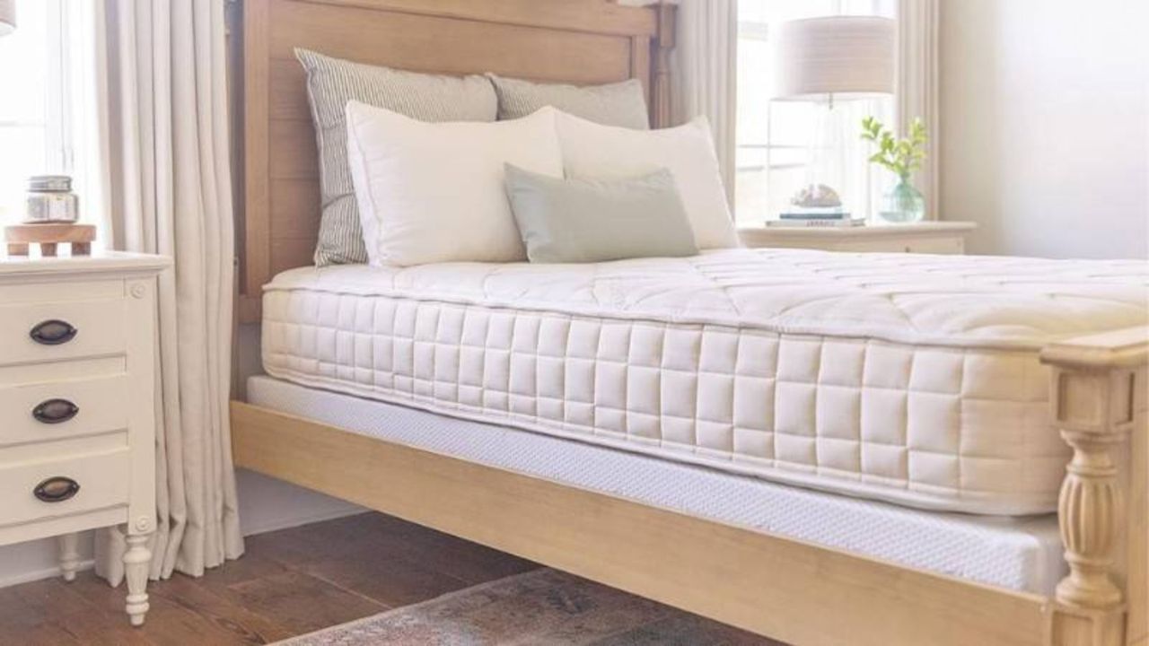 The best firm mattress, the Naturepedic Chorus Mattress, on a bed.