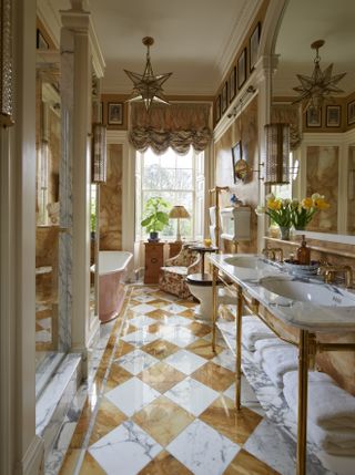 A view of Martin's bathroom with amber, marble adorned walls
