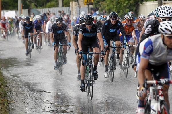 Team Sky riders can only laugh at having to negotiate streets flooded by rain.