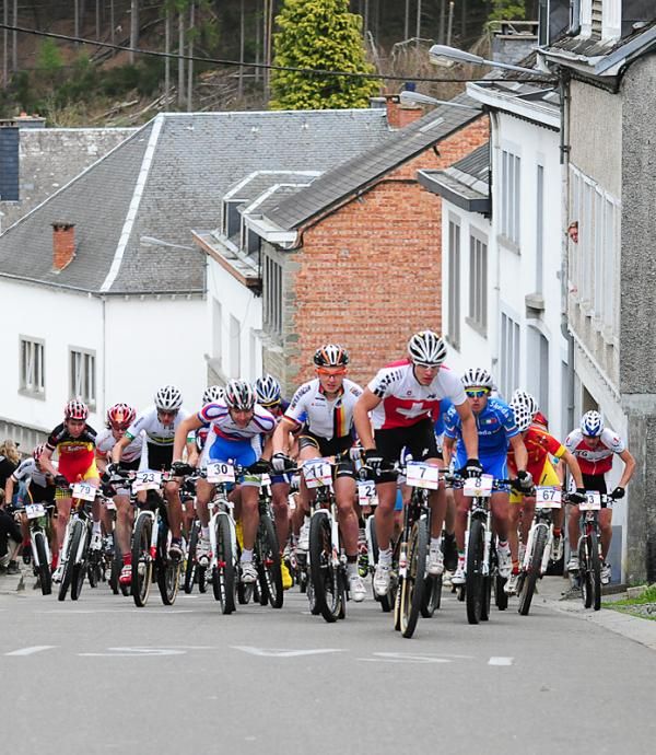 Riders on the steep road climb