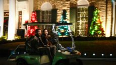 Riley Keough and Post Malone ride in a golf cart outside Graceland
