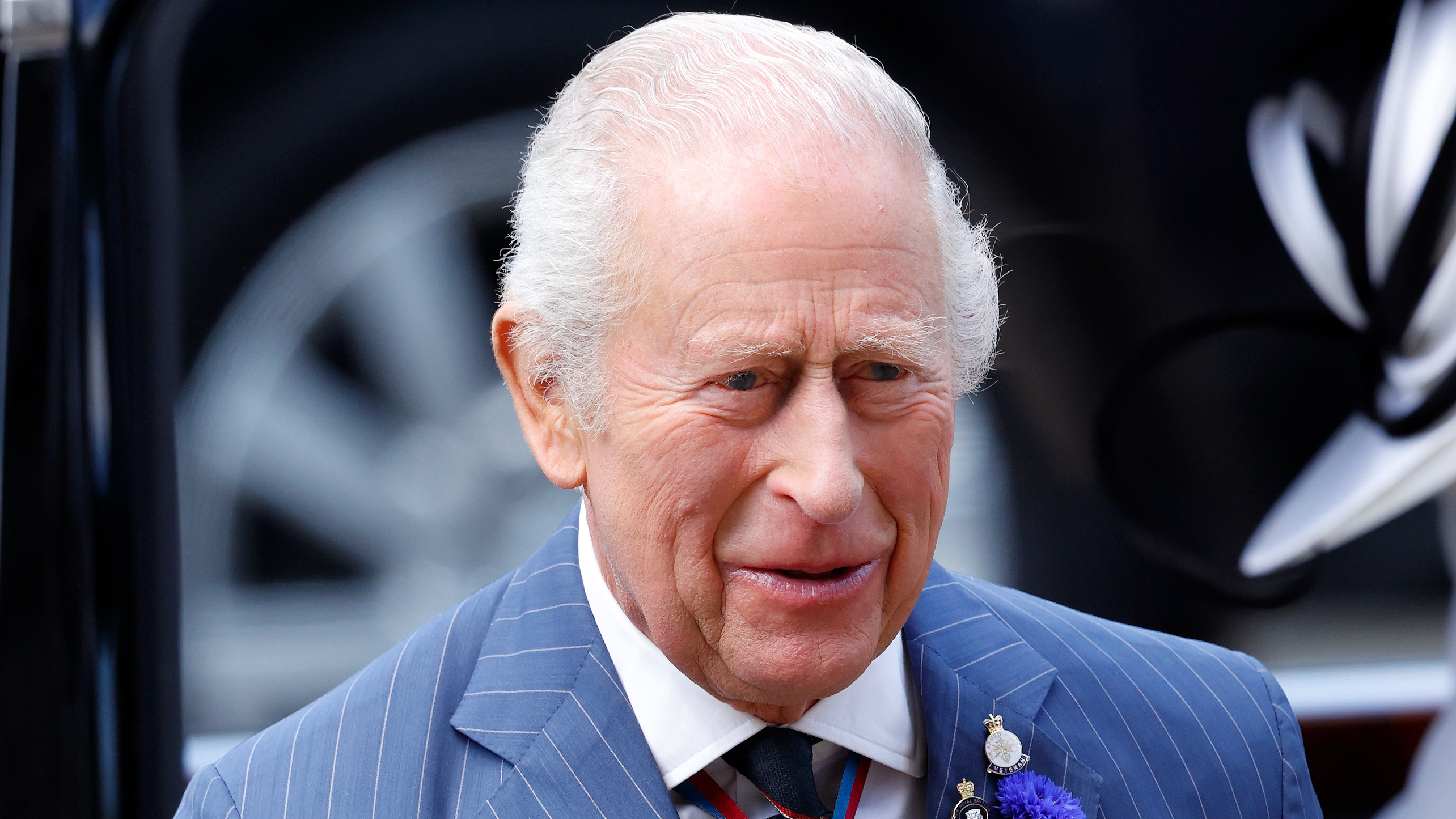 King Charles III (wearing a Royal Navy tie) attends a Service of Thanksgiving at Westminster Abbey