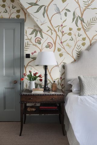 A bedroom with heavy printed in muted tones