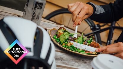 Female cyclist eating a meal outside