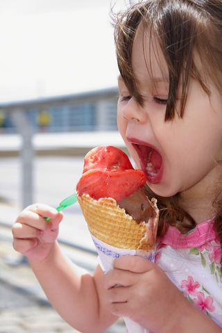 Girl eating ice cream on the street