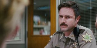 Scream 4 David Arquette looking skeptical in the office