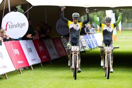 David George (left) and Kevin Evans (Nedbank 360Life) roll over the rain-soaked finish line to win the final stage and the overall title at the Cape Pioneer Trek