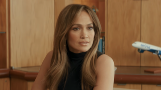 Jennifer Lopez in a turtleneck tank in Office Romance