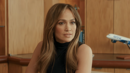 Jennifer Lopez in a turtleneck tank in Office Romance