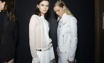 2 female models wearing all white clothing