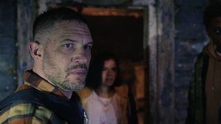 Tom Hardy standing in a doorway in the movie havoc