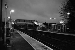 British train station at night taken on Ilford XP2 Super 35mm film