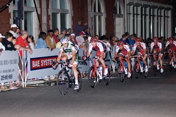 A Bahati Foundation rider leads a long line of KENDA Pro Cycling p/b GEARGRINDER riders