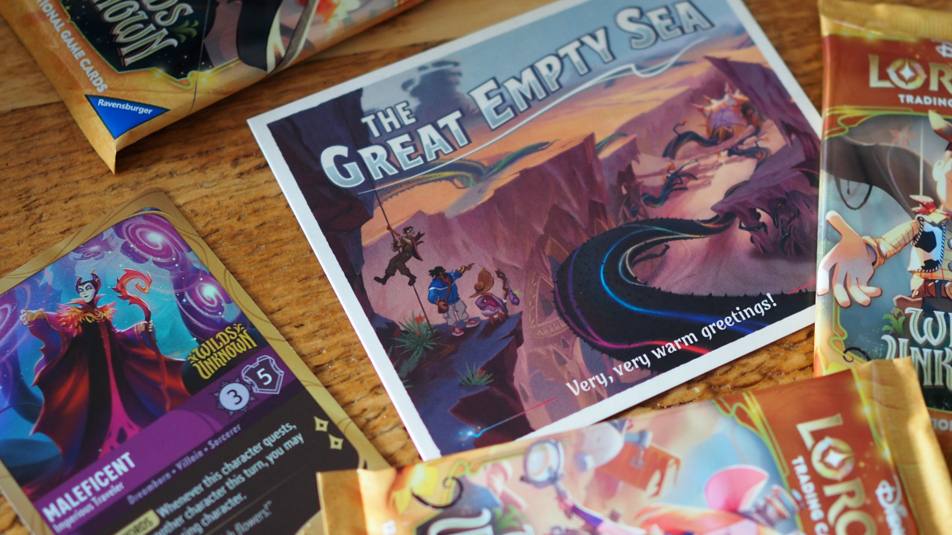 A Maleficent card alongside a postcard advertising the 'Great Empty Sea'