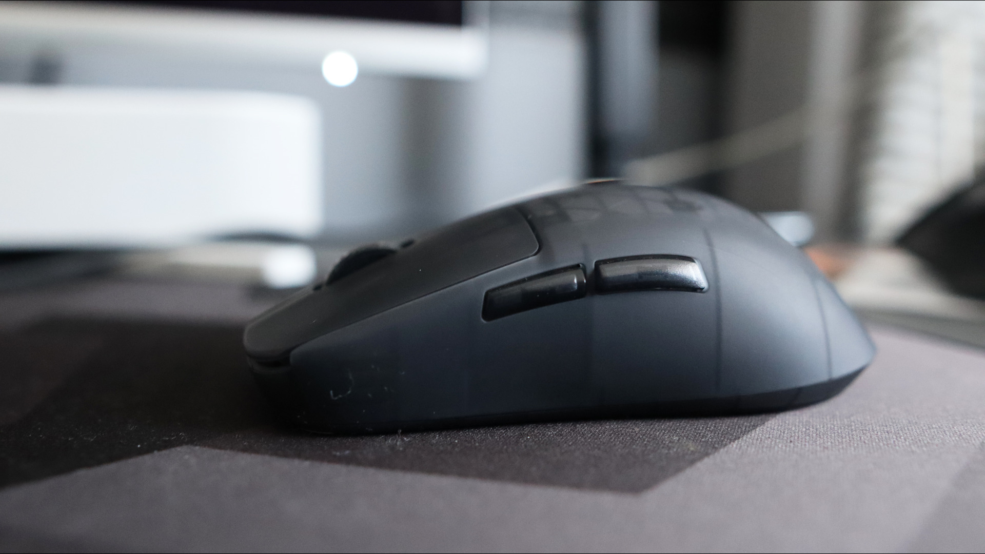 An Endgame Gear OP1w 4K gaming mouse on a desk.