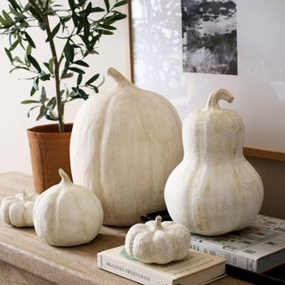 Handcrafted Terracotta Pumpkins on a mantel.