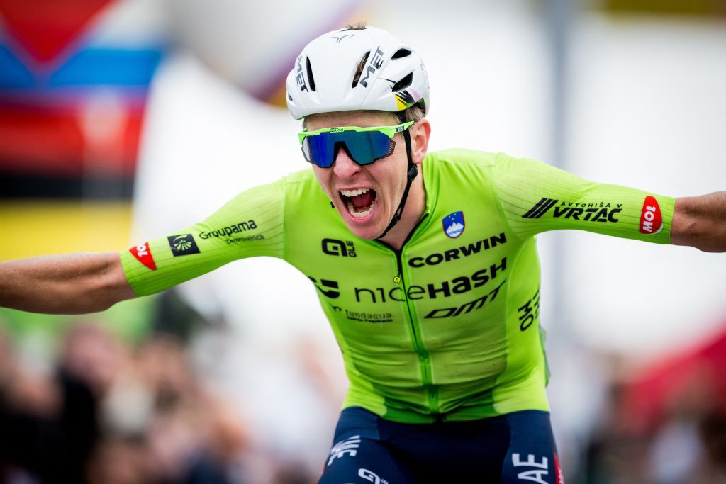 Slovenian Tadej Pogacar celebrates as he crosses the finish line to win the elite men road race at the 2024 UCI Road and Para-Cycling Road World Championships, Sunday 29 September 2024, in Zurich, Switzerland. The Worlds are taking place from 21 to 29 September. BELGA PHOTO JASPER JACOBS (Photo by JASPER JACOBS / BELGA MAG / Belga via AFP)