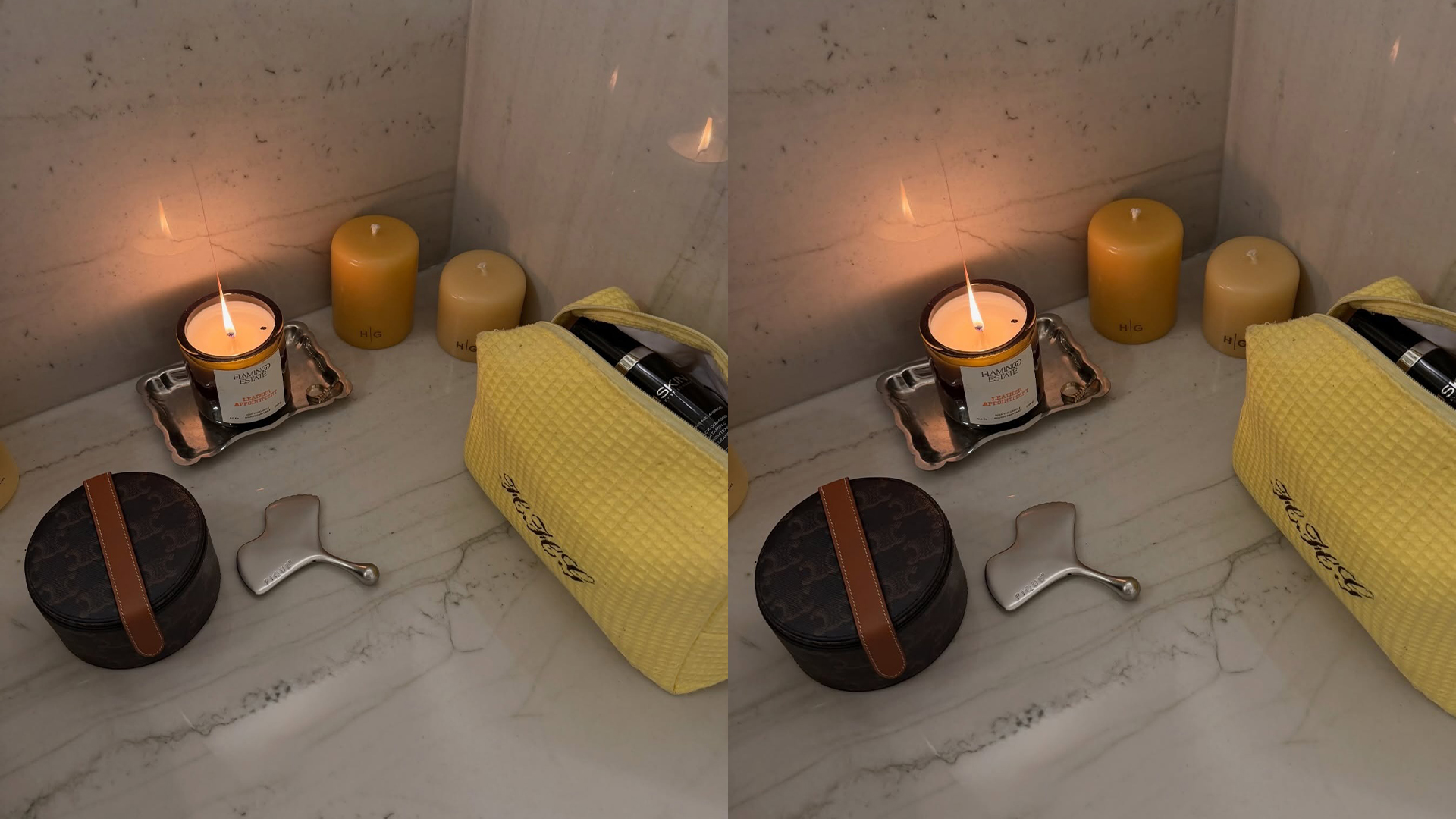A yellow toiletry bag, stainless steel gua sha, and a few candles are pictured don top of a table or counter. 