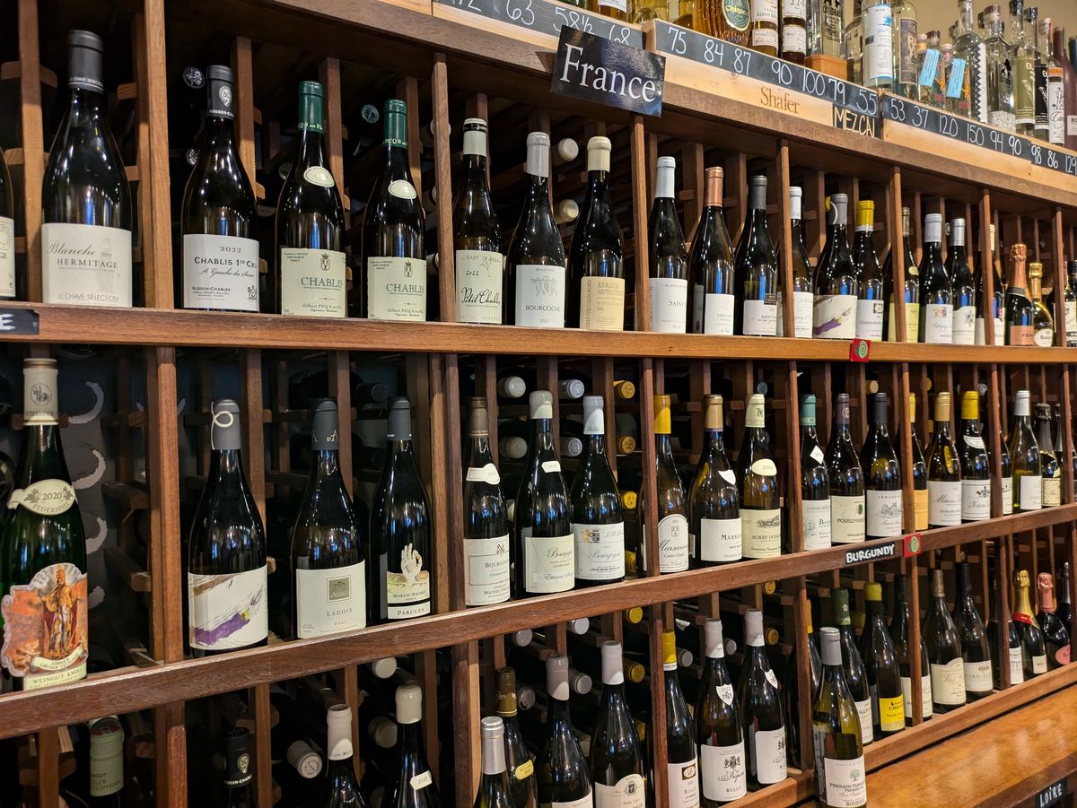 Multiple shelves of wine bottles in store shot by Pixel 8a