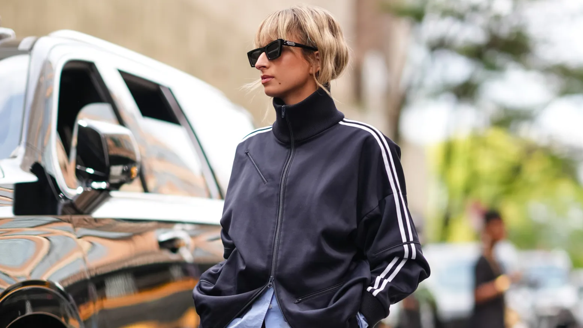 woman wearing a blue striped track jacket in New York