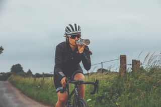 Image shows a rider getting the nutrition they need for cycling.